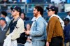 Nick, Kevin, and Joe, right of the Jonas Brothers react to a video presentation before a baseball game between the New York Yankees and the Philadelphia Phillies Tuesday, April 4, 2023, in New York. The Jonas Brothers will perform Saturday, Aug. 1, 2023 at Yankee Stadium. (AP Photo/Frank Franklin II)