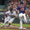 Detroit Tigers first baseman Spencer Torkelson, left, fields the throw as Houston Astros' Jose Abreu is safe at first on a single during the first inning of a baseball game, Tuesday, April 4, 2023, in Houston. (AP Photo/Eric Christian Smith)