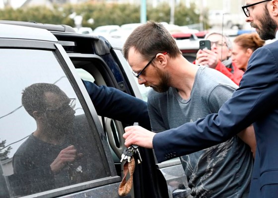 Steeve Gagnon is escorted by police out of court in March. (Jacques Boissinot / The Canadian Press files)