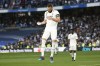 Real Madrid's Karim Benzema celebrates after scoring his side's third goal during a Spanish La Liga soccer match between Real Madrid and Valladolid at the Santiago Bernabeu stadium in Madrid, Spain, Sunday, April 2, 2023. (AP Photo/Pablo Garcia)