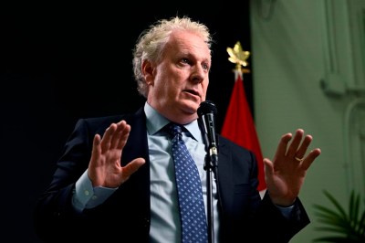Conservative leadership candidate Jean Charest answers questions from reporters after the third debate of the 2022 Conservative Party of Canada leadership race, in Ottawa, on Wednesday, Aug. 3, 2022. A Quebec Superior Court justice has ordered the Quebec government to pay former premier Jean Charest $385,000 over the release of his personal information during an investigation by the province's anti-corruption unit. THE CANADIAN PRESS/Justin Tang