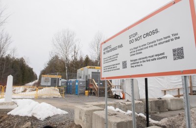 A sign advising people that entrance to Canada via Roxham road is illegal is shown on the Canada/US border in Hemmingford, Que., Saturday, March 25, 2023. THE CANADIAN PRESS/Graham Hughes