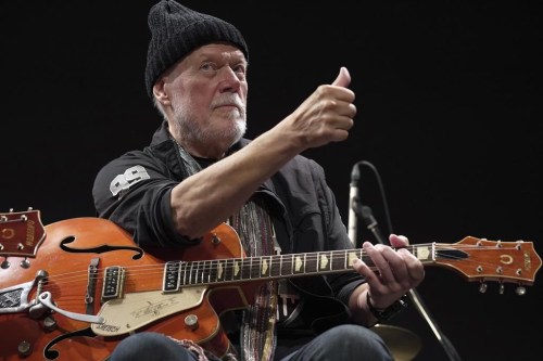 Canadian rock legend Randy Bachman poses with his reunited Gretsch guitar, which was stolen in 1977, during the Lost and Found Guitar Exchange Ceremony&nbsp;at the Canadian Embassy in Tokyo, Friday, July 1, 2022.&nbsp;Bachman will showcase more than 80 of his guitars in a new temporary exhibit set to open at Calgary's Studio Bell next month. THE CANADIAN PRESS/AP-Eugene Hoshiko
