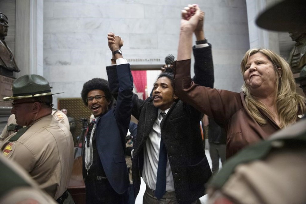 FILE - From left, Tennessee state Rep. Justin Pearson, state Rep. Justin Jones and state Rep. Gloria Johnson hold their hands up as they exit the House Chamber doors at Tennessee state Capitol Building in Nashville, Tenn., Monday, April 3, 2023. In Tennessee, three Democratic House members are facing expulsion for using a bullhorn in the House chamber to show support for pro-gun control protesters. In an increasingly polarized political atmosphere, experts say these kinds of harsh punishments for minority party members standing up for principles they believe in will likely become more common, especially when acts of civil disobedience clash with the rigid policies and procedures of legislative decorum. (Nicole Hester/The Tennessean via AP, File)