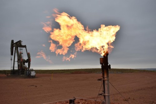 FILE - A flare burns natural gas at an oil well, Aug. 26, 2021, in Watford City, N.D. A lawsuit that Louisiana and other Republican-leaning states filed challenging figures the Biden administration uses to calculate damages from greenhouse gasses was dismissed Wednesday, April 5, 2023, by a federal appeals court. (AP Photo/Matthew Brown, File)