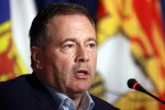 Alberta Premier Jason Kenney responds to a question from the media on the final day of the summer meeting of Canada's Premiers at the Fairmont Empress in Victoria on July 12, 2022. Roma advocates say discriminatory policies meant to keep families from making what then-immigration minister Jason Kenney called 