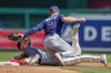 Tampa Bay Rays second baseman Taylor Walls tags out Washington Nationals' Alex Call on a steal attempt of second base during the third inning of a baseball game at Nationals Park, Wednesday, April 5, 2023, in Washington. (AP Photo/Alex Brandon)