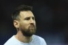 PSG's Lionel Messi warms up before the French League One soccer match between Paris Saint-Germain and Lyon at the Parc des Princes stadium in Paris, Sunday, April 2, 2023. (AP Photo/Aurelien Morissard)