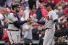 Atlanta Braves relief pitcher Jesse Chavez, right, and catcher Travis d'Arnaud celebrate a 5-2 victory over the St. Louis Cardinals in a baseball game Wednesday, April 5, 2023, in St. Louis. (AP Photo/Jeff Roberson)