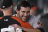 Baltimore Orioles starting pitcher Grayson Rodriguez gets a hug in the dugout after the fifth inning of a baseball game against the Texas Rangers in Arlington, Texas, Wednesday, April 5, 2023. (AP Photo/LM Otero)