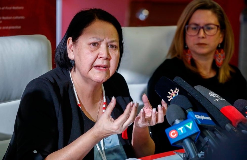 Kirstin Witwicki, right, cousin of Morgan Harris, listens in as Cathy Merrick, Grand Chief of the Assembly of Manitoba Chiefs, speaks to media in Winnipeg, Manitoba, Friday, Feb. 10, 2023. Merrick would like to see the Winnipeg landfill where two women's remains have been found in less than a year permanently shut down. THE CANADIAN PRESS/John Woods