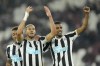 Newcastle's Joelinton, centre, celebrates with his teammates Alexander Isak, right, and Joe Willock after scoring his side's fifth goal during the English Premier League soccer match between West Ham United and Newcastle United at The London stadium in London, Wednesday, April 5, 2023. (AP Photo/Kirsty Wigglesworth)