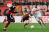 Nuremberg's Mats Moller Daehli, center, and Stuttgart's Josha Vagnoman fight for the ball during the quarterfinal DFB Cup soccer match between FC Nuremberg and VfB Stuttgart at Max Morlock Stadium in Nuremberg, Germany, Wednesday April 5, 2023. (Daniel Lob/dpa via AP)