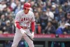 Los Angeles Angels' Shohei Ohtani reacts after home plate umpire Pat Hoberg called a pitch-clock violation against him while Ohtani batted against Seattle Mariners reliever Matt Brash during the sixth inning of a baseball game Wednesday, April 5, 2023, in Seattle. Ohtani was hit with a pitch clock violation as both a pitcher and a hitter, the first time that has happened in MLB history. (AP Photo/Lindsey Wasson)