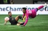 Los Angeles FC's Denis Bouanga, back left, watches as his shot goes wide of the goal past Vancouver Whitecaps goalkeeper Yohei Takaoka during the first half of a CONCACAF Champions League quarterfinal soccer match, in Vancouver, on Wednesday, April 5, 2023. THE CANADIAN PRESS/Darryl Dyck