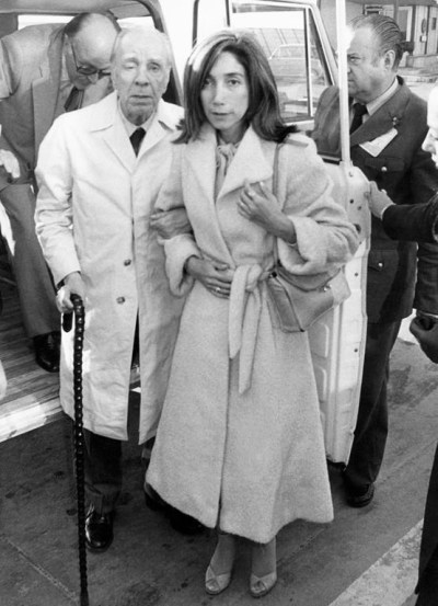 FILE - In this April 20, 1980 file photo, Argentine writer Jorge Luis Borges, accompanied by his secretary Maria Kodama, arrives in Madrid, Spain to receive the Spanish literary prize 