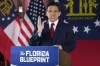 FILE - Florida Gov. Ron DeSantis speaks to a crowd at Adventure Outdoors gun store, Thursday, March 30, 2023, in Smyrna, Ga. Ahead of a highly anticipated presidential announcement, DeSantis will make his first appearance this year on Thursday, April 6, in Michigan, a battleground state transformed by Democratic-majorities and led by high-profile Gov. Gretchen Whitmer. (AP Photo/John Bazemore, File)