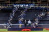 From left, Toronto Blue Jays president Mark Shapiro, Rogers Chairman Edward Rogers, and Rogers CEO Tony Staffieri, cut a giant ribbon in the outfield to unveil new renovations completed to the Rogers Centre stadium, home of the Toronto Blue Jays, in Toronto, Thursday, April 6, 2023. THE CANADIAN PRESS/Cole Burston