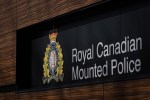 The RCMP logo is seen outside the force's 'E' division headquarters in Surrey, B.C., on Thursday, March 16, 2023. RCMP say an eight-year-old boy has died after he was struck by a school bus on a First Nation in Saskatchewan. THE CANADIAN PRESS/Darryl Dyck
