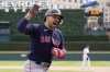 Boston Red Sox's Adam Duvall reacts after scoring on his three-run home run during the sixth inning of a baseball game against the Detroit Tigers, Thursday, April 6, 2023, in Detroit. (AP Photo/Carlos Osorio)