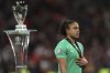Brazil's goalkeeper Leticia walks past the trophy after losing the Women's Finalissima soccer match between England and Brazil at Wembley stadium in London, Thursday, April 6, 2023. (AP Photo/Ian Walton)