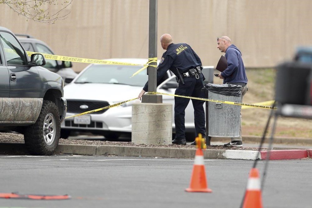Police investigate a shooting near Mahany Park in Roseville, Calif., Thursday, April 6, 2023. A man fleeing police in Northern California took two hostages at a public park on Thursday, killing one of them and wounding a California Highway Patrol officer before surrendering, authorities said.(Scott Strazzante/San Francisco Chronicle via AP)