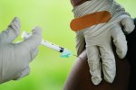FILE - A health worker administers a dose of COVID-19 vaccine during a vaccination clinic in Reading, Pa. On Friday, April 7, 2023, The Associated Press reported on stories circulating online incorrectly claiming the World Health Organization now says COVID-19 vaccines are “not recommended” for healthy children and teens. (AP Photo/Matt Rourke, File)