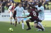 Inter's Romelu Lukaku, right, and Salernitana's Lorenzo Pirola vie for the ball during the Italian Serie A soccer match between Salernitana and Inter Milan at the Arechi stadium in Salerno, Italy, Friday, April 7, 2023. (Alessandro Garofalo/LaPresse via AP)
