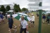 Patrons depart the course during a weather delay in the second round of the Masters golf tournament at Augusta National Golf Club on Friday, April 7, 2023, in Augusta, Ga. (AP Photo/David J. Phillip)