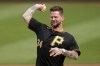 Former Pittsburgh Pirates pitcher A.J. Burnett throws a ceremonial first pitch before the Pirates home opener baseball game against the Chicago White Sox in Pittsburgh, Friday, April 7, 2023. (AP Photo/Gene J. Puskar)