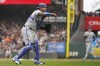 Kansas City Royals catcher Salvador Perez throws out San Francisco Giants' Mike Yastrzemski at first base during the sixth inning of a baseball game in San Francisco, Friday, April 7, 2023. (AP Photo/Eric Risberg)