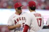Los Angeles Angels center fielder Mike Trout (27) greets designated hitter Shohei Ohtani (17) before a baseball game against the Toronto Blue Jays in Anaheim, Calif., Friday, April 7, 2023. (AP Photo/Ashley Landis)