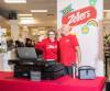 JESSICA LEE / WINNIPEG FREE PRESS
                                Zellers GM Ewa Turski waves while standing next to DJ Dave Filiatrault at the newly re-opened Zellers on the second floor of Hudson’s Bay at St. Vital Mall on Tuesday.