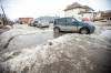 MIKAELA MACKENZIE / WINNIPEG FREE PRESS
                                On Gordon Avenue, near the intersection with Henderson Highway, a pothole has come to resemble a sinkhole.
