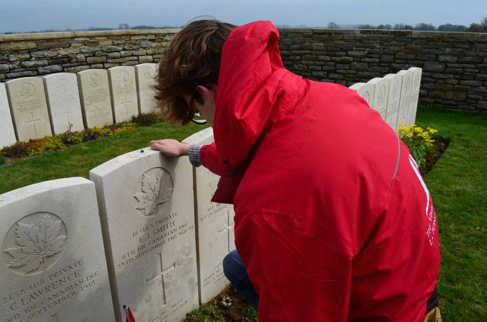 SUPPLIED
Aidan Nowicki visited the Sancourt British Cemetery in Nord, France on April 6, to lay a pebble on the gravesite of Private Ernest James Smith. The rock came from Smith’s family home in Winnipeg.