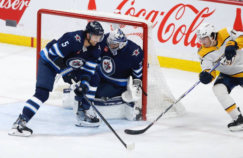 John Woods / THE CANADIAN PRESS
Connor Hellebuyck has appeared in an NHL-leading 62 games this season as the Jets need him to be at his very best as they vie for a wild-card playoff spot.