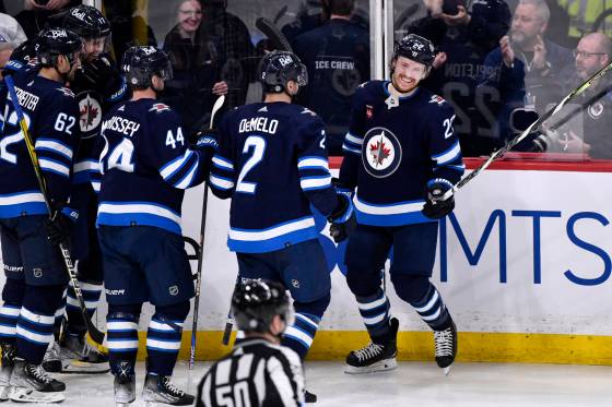 Winnipeg Jets' Mason Appleton celebrates his goal against the San Jose Sharks with Dylan Demelo (2) and Josh Morrissey (44) in Winnipeg on Monday.n (Fred Greenslade / Winnipeg Free Press)