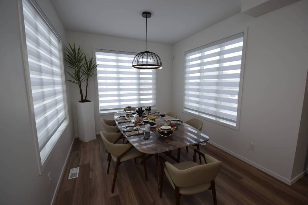 Surrounded by three huge windows, the solarium-like dining area is a functional, light-filled space.