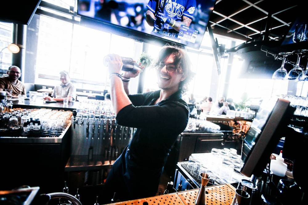 JOHN WOODS / WINNIPEG FREE PRESS
Earl’s on Main bartender Josh Sigurdson is ready and excited about the upcoming Winnipeg Jets’ playoff run.