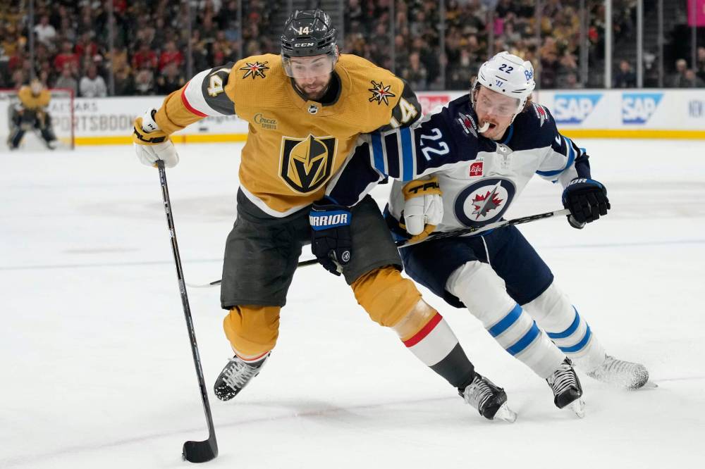 JOHN LOCHER / THE ASSOCIATED PRESS
Jets’ forward Mason Appleton (right) contains Golden Knights defenceman Nicolas Hague on Tuesday night in Las Vegas. The Jets' shutdown line did its job while also generating plenty of great offensive looks and a pair of goals.