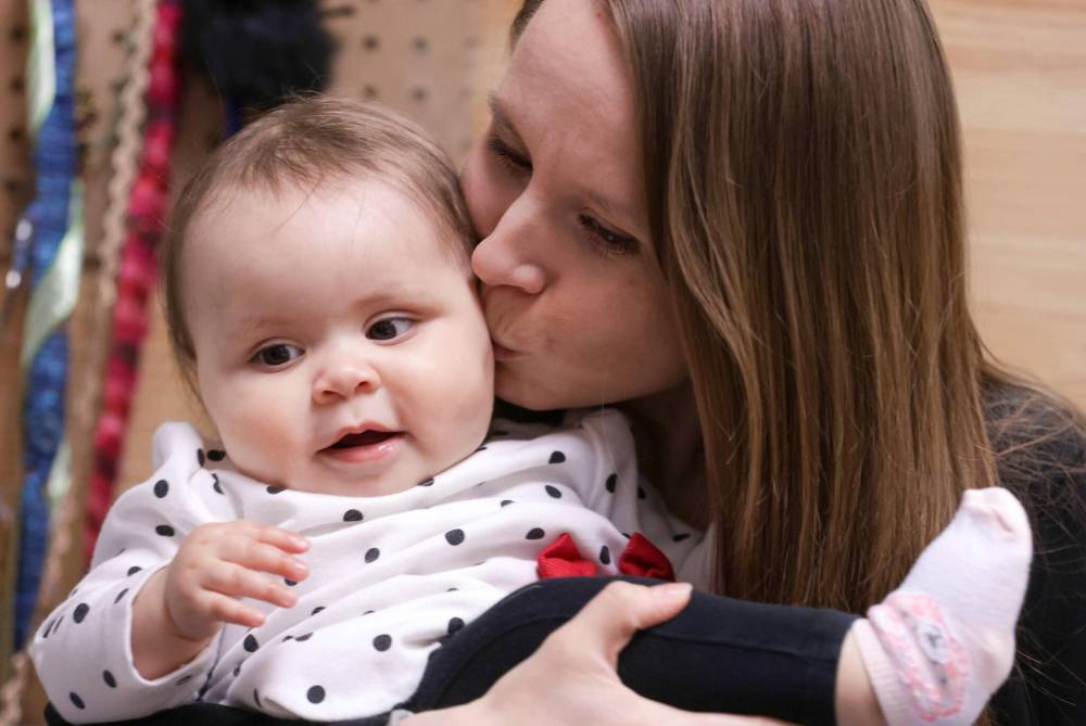 Samantha Raible is going to have to rely on family members to take care of her baby, Hannah, when she goes back to work in three months because there are no daycare spots available. (Ruth Bonneville / Winnipeg Free Press files)