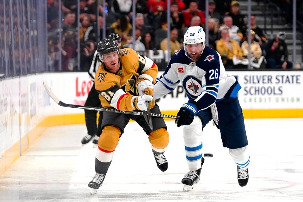 (AP Photo/Lucas Peltier)
Golden Knights centre Jonathan Marchessault shoots the puck past Winnipeg Jets right wing Blake Wheeler during the second period.