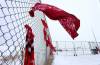 Red dresses and material are seen at Brady Road landfill in December 2022, where a group supporting search efforts for remains of murdered women protested. (Ruth Bonneville / Winnipeg Free Press files)