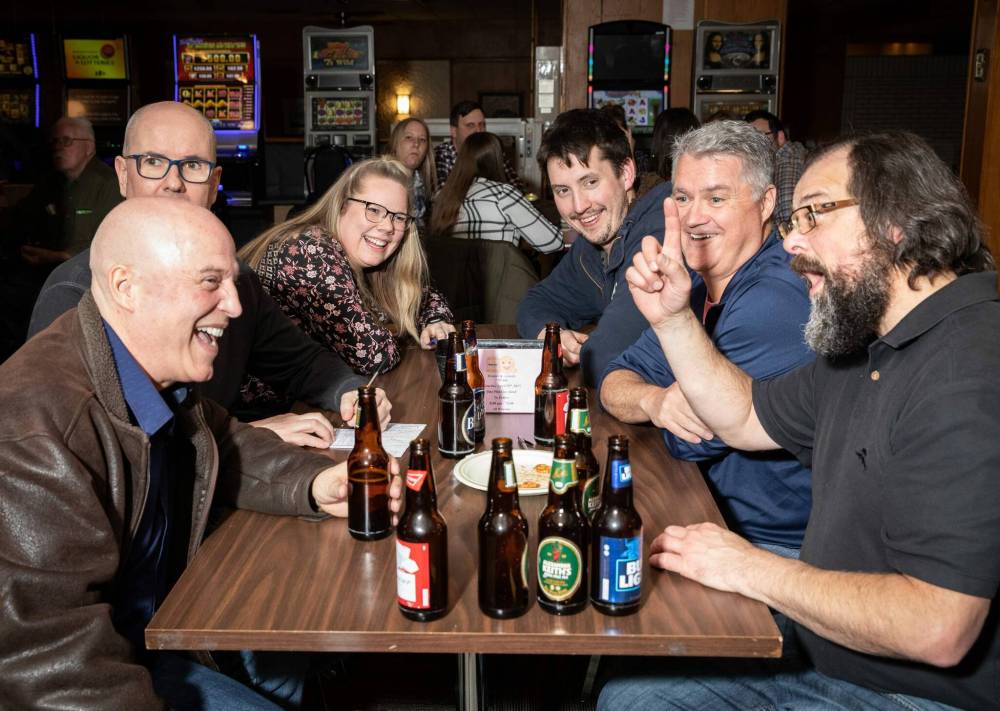 JESSICA LEE / WINNIPEG FREE PRESS
From left, the team of Richard A. Stokes, Garth Anderson, Ashley Parker, Nick Donovan, Kevin McDonald and Gunnar Gustafson take part in a Quizzlers interactive quiz night at the Transcona Legion earlier this month.