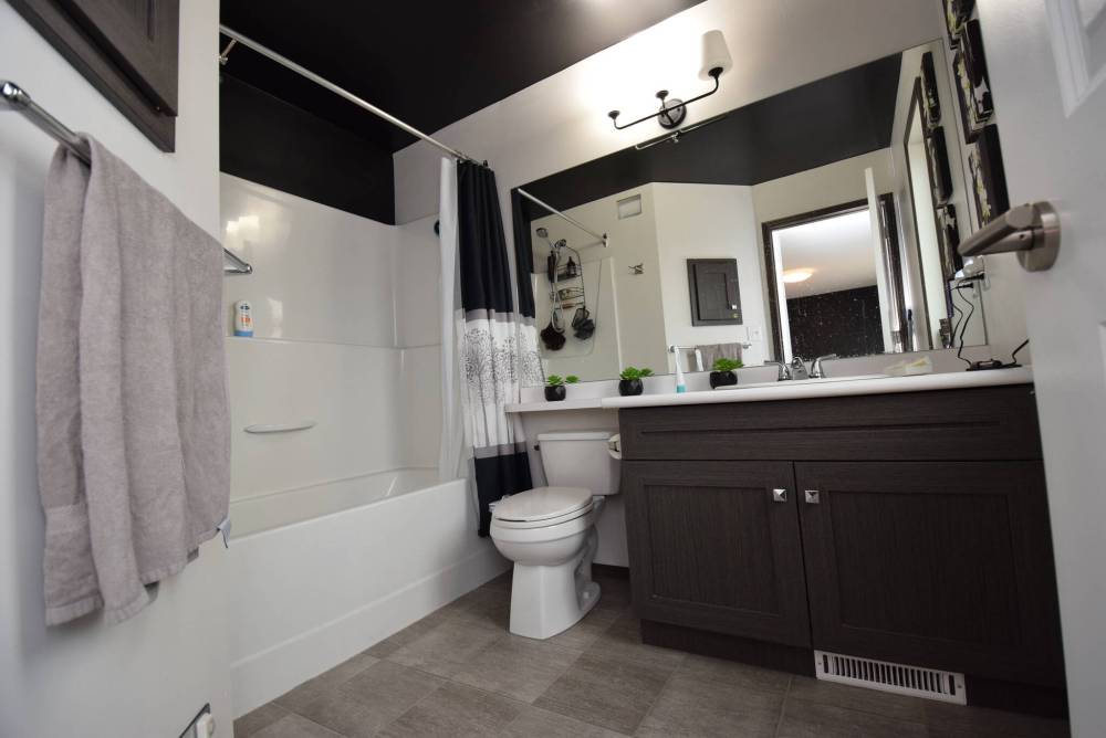 The ensuite is a well-appointed space that offers a perfect balance of function and style.