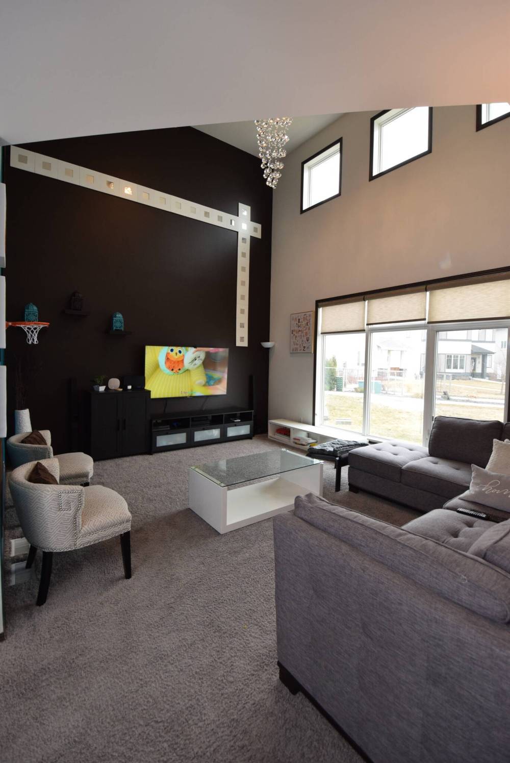 With its 17-foot ceiling, the family room is a breathtaking yet practical space.