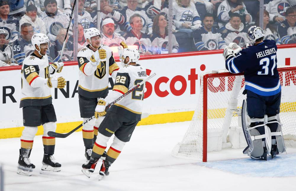 John Woods / The Canadian Press FILES
Vegas Golden Knights’ Keegan Kolesar (from left), Jack Eichel and Michael Amadio celebrate Kolesar’s goal against Winnipeg Jets goaltender Connor Hellebuyck, Saturday.