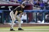FILE - San Diego Padres third base coach Matt Williams pauses on the field during the seventh inning of a baseball game against the Arizona Diamondbacks in Phoenix, Sunday, Sept. 18, 2022. The San Diego Padres third base has colon cancer and will have surgery on Friday, March 31, 2023. (AP Photo/Ross D. Franklin,File)
