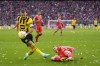 Dortmund's Marco Reus, left, vies for the ball with Bayern's Matthijs de Ligt during the German Bundesliga soccer match between FC Bayern Munich and Borussia Dortmund at the Allianz Arena stadium in Munich, Germany, Saturday April 1, 2023. (AP Photo/Matthias Schrader)