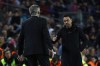 Barcelona's head coach Xavi Hernandez, right, greats Real Madrid's head coach Carlo Ancelottim at the end of the Spanish Copa del Rey semifinal, second leg soccer match between Barcelona and Real Madrid at the Camp Nou stadium in Barcelona, Spain, Wednesday, April 5, 2023. Real Madrid won 4-0. (AP Photo/Joan Monfort)